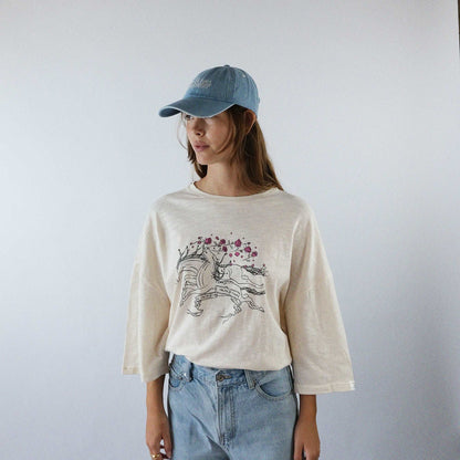 Unisex oversized shirt, 100% cotton, drop shoulder cut, creme color, galloping horses print in black and pink